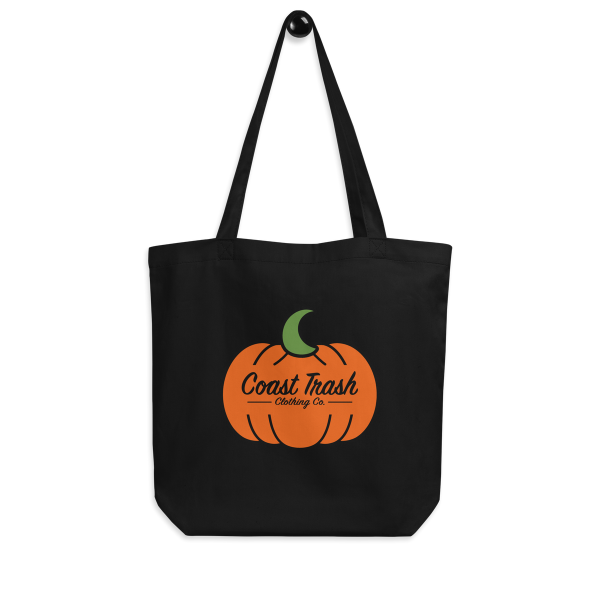 Front of the black Just One More House Eco Tote with orange Coast Trash pumpkin and green crescent artwork. The same design is printed on both sides.